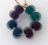 Clearly Color Cleary Color pairs - bold intense shades of purple, steel blue, berry and teal. Each has a bold colored heart or center and is cased in clear. You can order each color separately or the set of 8 beads as shown and in glossy or matte.Bead Size:7x12 mmAmount:1 BeadHole Size:2.5 mm Glossy,Steel Blue,Glossy,Berry Teal,Glossy,Purple,Glossy,Full Set of 4 Pairs,Matte,Steel Blue,Matte,Berry Teal,Matte,Purple,Matte,Full Set of 4 Pairs