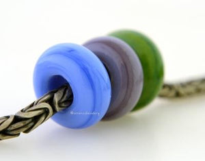 Comfy Quilt Trio European Charm Set A trio of European charm bracelet beads in grumpy blue, lavender blue and green marble.These lampwork beads will fit your European charm style bracelet.&gt;7x13-14 mm3 Beads5 mm holeprice is per bead set Glossy,Matte