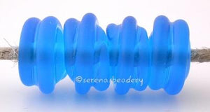 Dark Aqua Tumbled Raised Spirals transparent dark aqua beads with a raised spiral - tumbled for a soft matte finish with glossy highlights6x12 mmprice is per bead Default Title