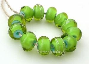 Dragon Tears A set of grass green over light blue in a spacer, a nugget, and with fine silver. Available either glossy or matte. 6x12 mm 2.5 mm hole price is per set of 12 beads Glossy,Matte