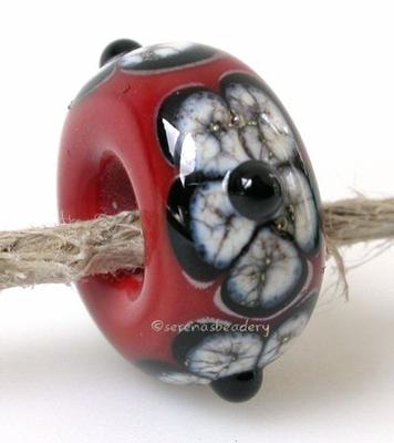 European Charm Style Cherry Red Silvered Ivory Flowers A cherry red base with my black and silvered ivory flowers in a bead big enough for your european charm style bracelet.approximately 7x14 mmhole size: 5mm Default Title