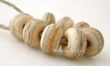 Dark Ivory Fine Silver Wraps dark ivory wrapped with fine silver~~~~~~~~~~~~~~~~~~~~~~~~~~6x11 mm8 Beads2.5 mm hole Glossy,Matte
