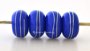4 LIGHT COBALT BLUE Light cobalt blue lampwork glass beads with fine silver wire wraps. Available in glossy or matte.~~~~~~~~~~~~~~~~~~~~~~~~~~6x11, 12 or 7x13 mm4 Beads2.5 mm hole Glossy,11 mm,Glossy,12 mm,Glossy,13 mm,Matte,11 mm,Matte,12 mm,Matte,13 mm