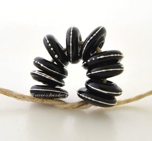 Black Mini Fine Silver Dot Wavy Disks A set of 10 black glass lampwork disks with wraps of fine silver dots in a mini size.~~~~~~~~~~~~~~~~~~~~~~~~~~3x10-11 mm10 Beads1.5 mm hole Glossy,Matte