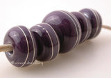 Dark Purple Fine Silver Wire Wraps Focal Set Dark purple with fine silver wire wraps. Available in glossy or matte.4 beads at 11 mm and one focal at 13 mm~~~~~~~~~~~~~~~~~~~~~~~~~~5 Beads2.5 mm hole Glossy,Matte