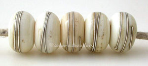 LIGHT IVORY with Fine Silver Wire Wraps Light Ivory wrapped with fine silver.~~~~~~~~~~~~~~~~~~~~~~~~~~6x11, 12 or 7x13 mm5 Beads2.5 mm hole Glossy,11 mm,Glossy,12 mm,Glossy,13 mm,Matte,11 mm,Matte,12 mm,Matte,13 mm