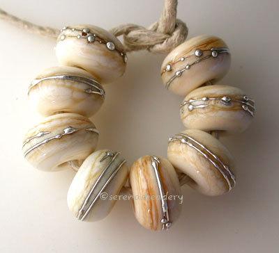 Dark Ivory Fine Silver Wraps dark ivory wrapped with fine silver~~~~~~~~~~~~~~~~~~~~~~~~~~6x11 mm8 Beads2.5 mm hole Glossy,Matte