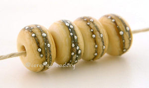 4 Dark Ivory Fine Silver Dots Dark ivory lampwork glass beads with fine silver droplets.~~~~~~~~~~~~~~~~~~~~~~~~~~6x11, 12 or 7x13 mm4 Beads2.5 mm hole Glossy,11 mm,Glossy,12 mm,Glossy,13 mm,Matte,11 mm,Matte,12 mm,Matte,13 mm