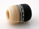 Black and Ivory European Charm with Fine Silver One European charm style bracelet bead with black, ivory, silvered ivory, fine silver.Bead Size: 13x11 mmAmount: 1 BeadHole Size: 5 mm Glossy,Matte