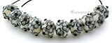 Silvered Ivory and Black Flowers a pair of ivory beads with black and silvered ivory flowers 6x12 mm 1.5 mm hole   Glossy,Matte