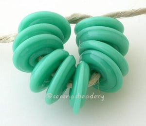 Jade Palace Wavy Disk Spacer wavy disks in jade palace2 sizes available: 11-12 mm with 1.5 mm hole or 13-14 mm with 2.5 mm holeprice is per 1 disk 11-12 mm 1.5 mm hole,12-13 mm 2.5 mm hole