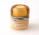 Light Amber Beach European Charm One european charm style bracelet bead with ivory, silvered ivory, fine silver and light amber.Bead Size:13x11 mmAmount:1 BeadHole Size:5 mm Glossy,Matte