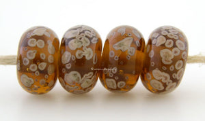 Maple Latte Maple brown lampwork glass beads with creamy latte frit.Bead Size: 6x11-12 or 7x13-14 mmHole Size: 2.5 mmprice is for one bead with a discount for 4 or more 11-12 mm,Glossy,13-14 mm,Glossy,11-12 mm,Matte,13-14 mm,Matte