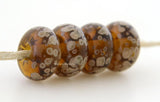 Maple Latte Maple brown lampwork glass beads with creamy latte frit.Bead Size: 6x11-12 or 7x13-14 mmHole Size: 2.5 mmprice is for one bead with a discount for 4 or more 11-12 mm,Glossy,13-14 mm,Glossy,11-12 mm,Matte,13-14 mm,Matte