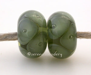 Mojito and Olive Green Bubbles mojito and olive green bubbles 7x12 mm 2.5mm hole price is per bead All of my lampwork glass beads are individually handmade using Effetre, Vetrofond, or Lauscha, Reichenbach, Double Helix, and Bullseye glass rods. They are annealed in a digitally controlled kiln for everlasting strength and durability. Default Title