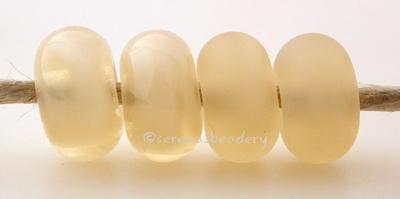 Mystic Beige Color Notes: Mystic colors have a wonderful almost vintage givre look to them. There is a streak of opaque color within the transparent color. 5x10 mm Available shapes and sizes:Round Bead Shapes: Available to order 8 to 15 mm with hole sizes ranging from 1.5 to 5 mm. See drop down menu for the exact options. Shown here in 8, 9 and 10 mm with both a 2.5 mm and 1.5 mm hole. 4 and 5 mm holes will fit European Charm style jewelry.Also available in a wavy disk or bead cap:. Pressed bead shapes:Lent