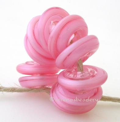 Mystic Pink Wavy Disk Spacer wavy disks in mystic pink2 sizes available: 11-12 mm with 1.5 mm hole or 13-14 mm with 2.5 mm holeprice is per 1 disk 11-12 mm 1.5 mm hole,12-13 mm 2.5 mm hole