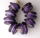 Double Purple Raised Spiral New Violet beads with a dark violet raised spiral. 6x12 mm price is per bead Default Title