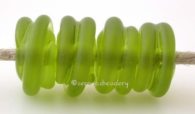 Olive Tumbled Raised Spirals transparent olive green beads with a raised spiral - tumbled for a soft matte finish with glossy highlights6x12 mmprice is per bead Default Title