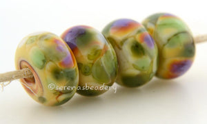 Canyon Morning Pale yellow lampwork glass beads with green and purple frit.Bead Size: 6x11-12 or 7x13-14 mmHole Size: 2.5 mmprice is for one bead with a discount for 4 or more 11-12 mm,Glossy,13-14 mm,Glossy,11-12 mm,Matte,13-14 mm,Matte