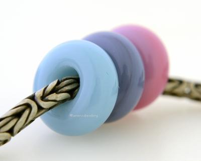 Pastel Flower Garden Trio European Charm Set A trio of European charm bracelet beads in powder blue, lavender blue, and pink.These lampwork beads will fit your european charm style bracelet.7x13-14 mm3 Beads5 mm holeprice is per bead set Glossy,Matte