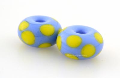 Periwinkle Yellow Dice Dots A periwinkle base with bright acid yellow dice dots. 5x11 mm price is per bead Glossy,Matte