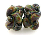 Strictly Raku Wovens a pair of wovens in raku These woven beads are a very intricate and unique design with lots of texture. These are all one color for plenty of sparkle. 7x13 mm price is per pair Glossy,Matte