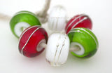 Green, Red & Clear Fine Silver Wraps A set of dark grass green, red and cyrstal clear white heart bead wrapped with strands of fine silver. 6x12 mm price is per 6 bead set Glossy,Matte