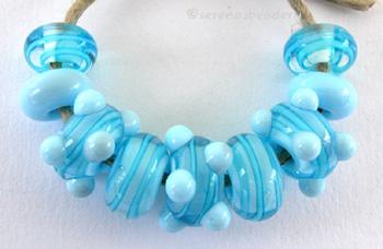 Sky Blue and Aqua Ribbon Spirals A set of nine beads in sky blue base with encased aqua ribbons and sky blue dots.6x12 mm Default Title