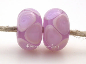 Soft Lavender and Crocus Bubbles soft lavender and crocus bubbles 7x12 mm 2.5mm hole price is per bead All of my lampwork glass beads are individually handmade using Effetre, Vetrofond, or Lauscha, Reichenbach, Double Helix, and Bullseye glass rods. They are annealed in a digitally controlled kiln for everlasting strength and durability. Default Title