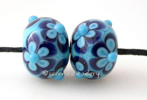 Turquoise and Blue Flowers a pair of turquoise blue beads with blue and turquoise flowers 6x12 mm    Glossy,Matte