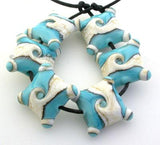 Turquoise Ivory Twists Turquoise and dark ivory twisted together, pressed into a pillow and cornered with layered dots. 15 mm price is per pair Glossy,Matte