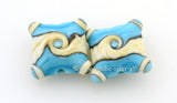 Turquoise Ivory Twists Turquoise and dark ivory twisted together, pressed into a pillow and cornered with layered dots. 15 mm price is per pair Glossy,Matte