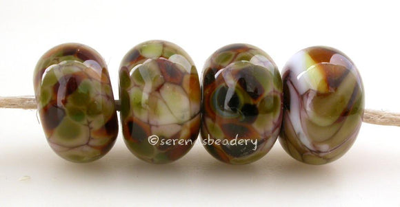 Psyched Violet purple lampwork glass beads with cream nougat, brown, and green frit.Bead Size: 6x11-12 or 7x13-14 mmHole Size: 2.5 mmprice is for one bead with a discount for 4 or more 11-12 mm,Glossy,13-14 mm,Glossy,11-12 mm,Matte,13-14 mm,Matte