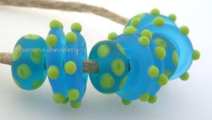 Beach Fun a set of pea green dotted aqua disks and donuts with a matte finishdonuts are 5x11mm and wavy disks are 3x14 mmset includes 4 donut dice dots and 6 wavy disks Default Title