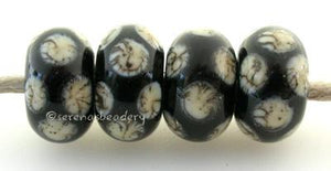Black Silvered Ivory Dice Dots A black base with silvered ivory dice dots. 5x11 mm price is per bead Glossy,Matte