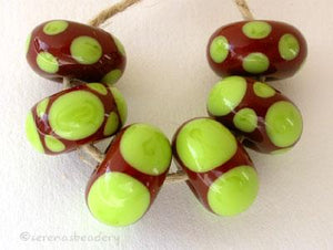 Brown and Pea Green Dot Set a set of six bead with a brown base and pea green dots 5x11 mm price is per set of beads Glossy,Matte