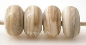 Fossil Color Notes: organic blend of ivory and brown 5x10 mm Available shapes and sizes:Round Bead Shapes: Available to order 8 to 15 mm with hole sizes ranging from 1.5 to 5 mm. See drop down menu for the exact options. Shown here in 8, 9 and 10 mm with both a 2.5 mm and 1.5 mm hole. 4 and 5 mm holes will fit European Charm style jewelry.Also available in a wavy disk or bead cap:. Pressed bead shapes:Lentil - 12x13 mm in size with a 1.5mm hole.: Pillow 13 mm square with a 1.5 mm hole.: Tab: Default Title