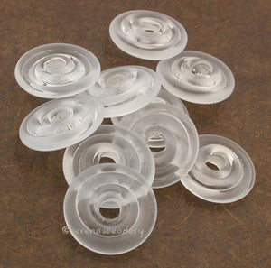 Crystal Tumbled Wavy Disk Spacer  10 tumbled wavy disks in crystal2 sizes available: 11-12 mm with 1.5 mm hole or 13-14 mm with 2.5 mm holeprice is per 10 disks 11-12 mm 1.5 mm hole,12-13 mm 2.5 mm hole