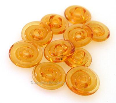 Light Amber Wavy Disk Spacer  10 wavy disks in light amber2 sizes available: 11-12 mm with 1.5 mm hole or 13-14 mm with 2.5 mm holeprice is per 10 disks 11-12 mm 1.5 mm hole,12-13 mm 2.5 mm hole