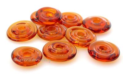 Amber Wavy Disk Spacer  10 wavy disks in amber2 sizes available: 11-12 mm with 1.5 mm hole or 13-14 mm with 2.5 mm holeprice is per 10 disks 11-12 mm 1.5 mm hole,12-13 mm 2.5 mm hole