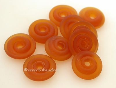 Amber Matte Wavy Disk Spacer 10 matte wavy disks in dark amber2 sizes available: 11-12 mm with 1.5 mm hole or 13-14 mm with 2.5 mm holeprice is per 10 disks 11-12 mm 1.5 mm hole,12-13 mm 2.5 mm hole