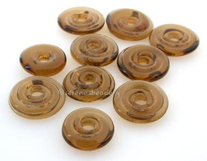 Dark Smoke Topaz Wavy Disk Spacer  10 wavy disks in a dark smoke topaz2 sizes available: 11-12 mm with 1.5 mm hole or 13-14 mm with 2.5 mm holeprice is per 10 disks 11-12 mm 1.5 mm hole,12-13 mm 2.5 mm hole