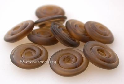 Dark Smoke Topaz Tumbled Wavy Disk Spacer 10 tumbled wavy disks in a dark smoke topaz2 sizes available: 11-12 mm with 1.5 mm hole or 13-14 mm with 2.5 mm holeprice is per 10 disks 11-12 mm 1.5 mm hole,12-13 mm 2.5 mm hole