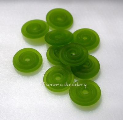 Dark Grass Green Matte Wavy Disk Spacer  10 wavy disks in dark grass green in a matte finish2 sizes available: 11-12 mm with 1.5 mm hole or 13-14 mm with 2.5 mm holeprice is per 10 disks 11-12 mm 1.5 mm hole,12-13 mm 2.5 mm hole