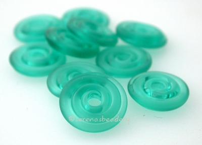 Teal Tumbled Wavy Disk Spacer 10 tumbled wavy disks in light teal2 sizes available: 11-12 mm with 1.5 mm hole or 13-14 mm with 2.5 mm holeprice is per 10 disks 11-12 mm 1.5 mm hole,12-13 mm 2.5 mm hole