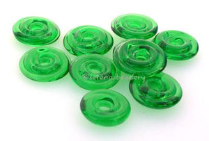 Light Emerald Green Wavy Disk Spacer  10 wavy disks in light emerald green2 sizes available: 11-12 mm with 1.5 mm hole or 13-14 mm with 2.5 mm holeprice is per 10 disks 11-12 mm 1.5 mm hole,12-13 mm 2.5 mm hole
