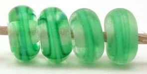 Grass Green Ribbon Color Notes: grass green ribbon cased in clear 5x10 mm Available shapes and sizes:Round Bead Shapes: Available to order 8 to 15 mm with hole sizes ranging from 1.5 to 5 mm. See drop down menu for the exact options. Shown here in 8, 9 and 10 mm with both a 2.5 mm and 1.5 mm hole. 4 and 5 mm holes will fit European Charm style jewelry.Also available in a wavy disk or bead cap:. Pressed bead shapes:Lentil - 12x13 mm in size with a 1.5mm hole.: Pillow 13 mm square with a 1.5 mm hole.: Tab: De