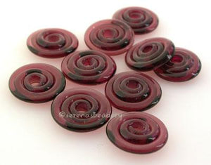 Dark Amethyst Wavy Disk Spacer  10 wavy disks in dark amethyst2 sizes available: 11-12 mm with 1.5 mm hole or 13-14 mm with 2.5 mm holeprice is per 10 disks 11-12 mm 1.5 mm hole,12-13 mm 2.5 mm hole