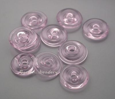 Rose Quartz Wavy Disk Spacer  10 wavy disks in rose quartz2 sizes available: 11-12 mm with 1.5 mm hole or 13-14 mm with 2.5 mm holeprice is per 10 disks 11-12 mm 1.5 mm hole,12-13 mm 2.5 mm hole